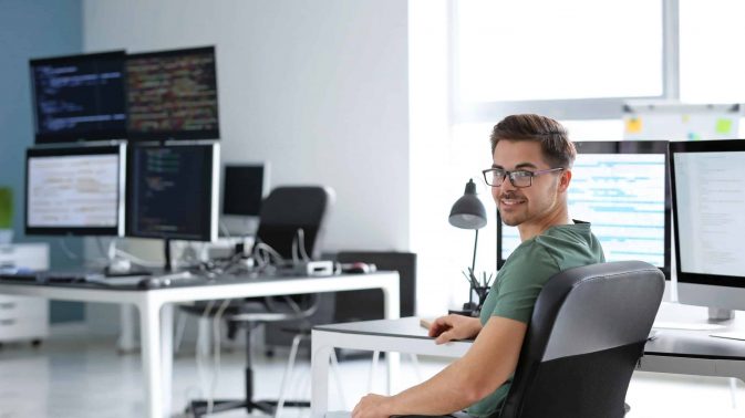 Portrait of male programmer in office